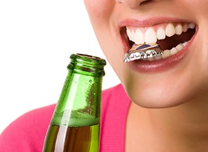 Woman opens bottle with teeth is headed for a dental emergency in Newington