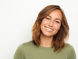 Woman with bright smile enjoying benefits of teeth whitening