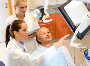 Dentist and patient discussing candidacy for All-on-4 implants