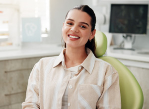 Happy dental patient in treatment chair