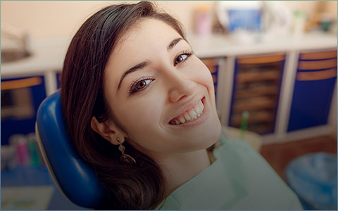 Smiling woman in dental chair