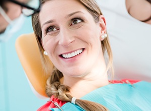 Woman in dental chair smiling