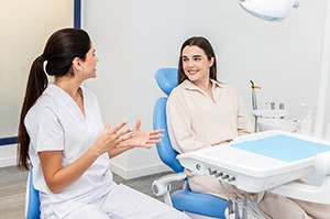 Patient and dental team member having conversation