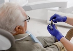 Dentist explaining dental implants to patient