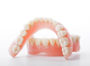 set of full dentures in Newington against white background