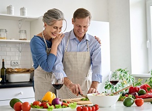 Mature couple preparing a meal together