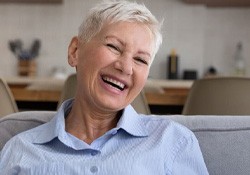 Laughing, smiling older woman with dentures