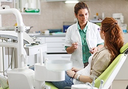 Patient and dentist discussing plan for emergency treatment