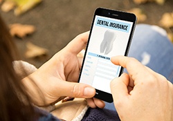 Using smartphone to learn about dental insurance benefits