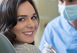 Happy woman at appointment for preventive dental care