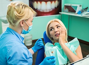 Pained patient visiting her Newington emergency dentist