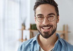 young man with dental implants in Newington