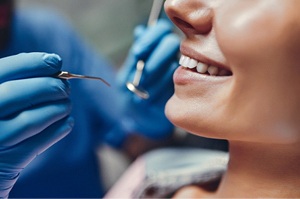 close-up of woman getting exam at dentist’s office