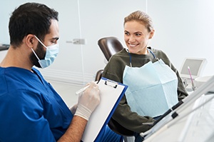 Dentist and patient discussing treatment options