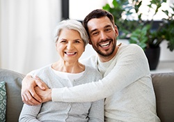 Mother and adult son, both potential candidates for dental implants