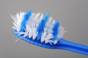 Frayed toothbrush, brushing too hard can harm dental implants