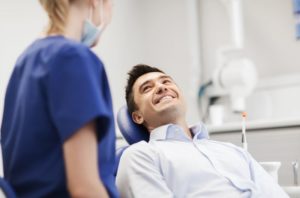 Patient smiling after successful treatment for knocked-out tooth