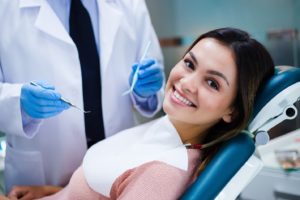 Smiling patient at appointment to use her dental insurance in Newington