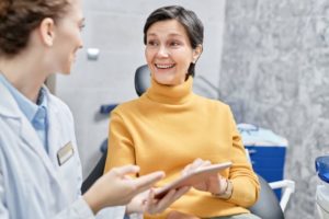 Dentist and patient discussing treatment plan