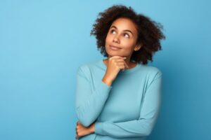 Young woman wearing curious expression