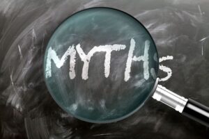 Magnifying glass placed over the word “myths” 